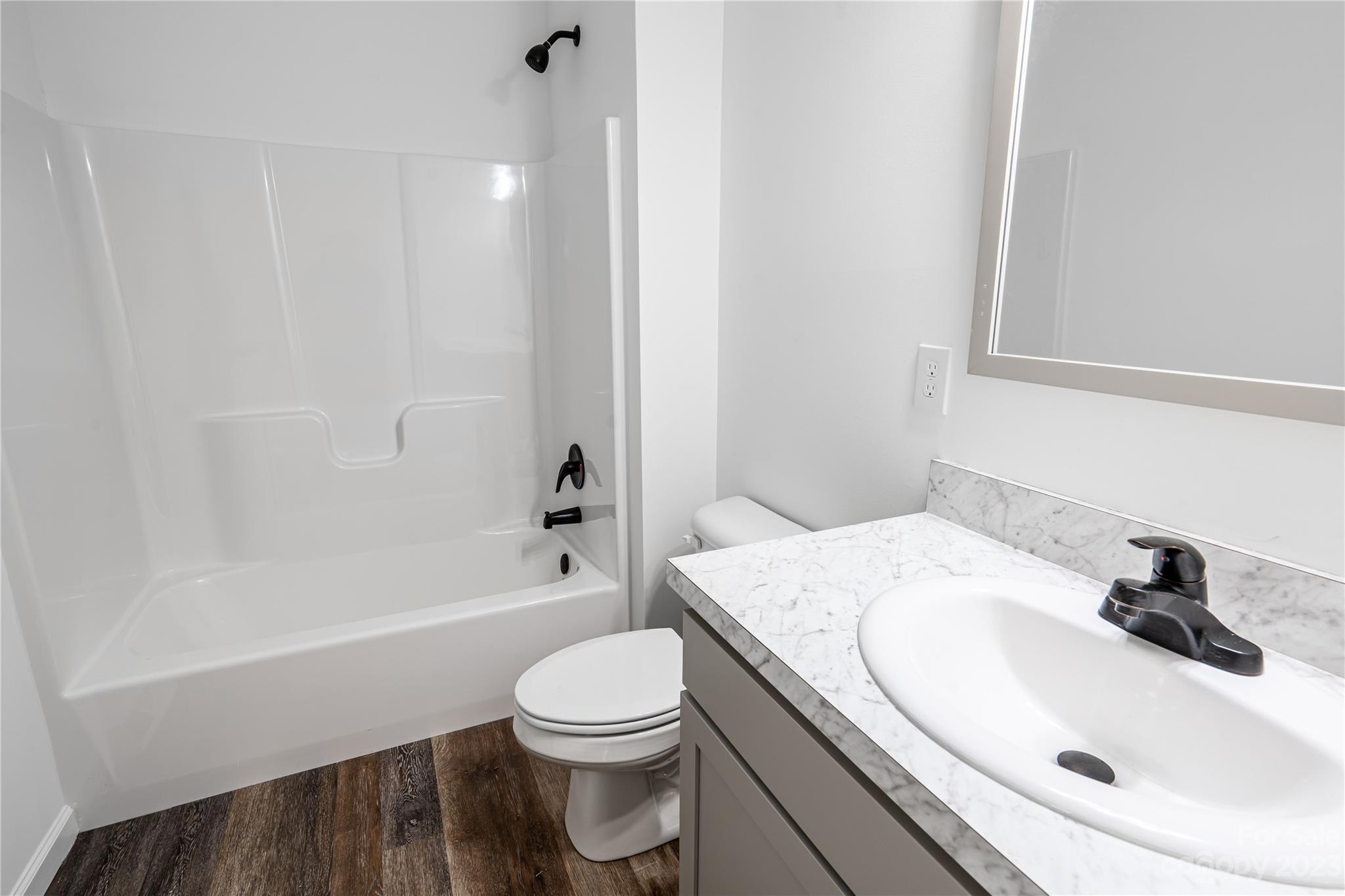 85 Rocky Lane Road Clyde, NC 28721 - Photo 28 of 37 a bathroom with a sink a toilet and a bathtub