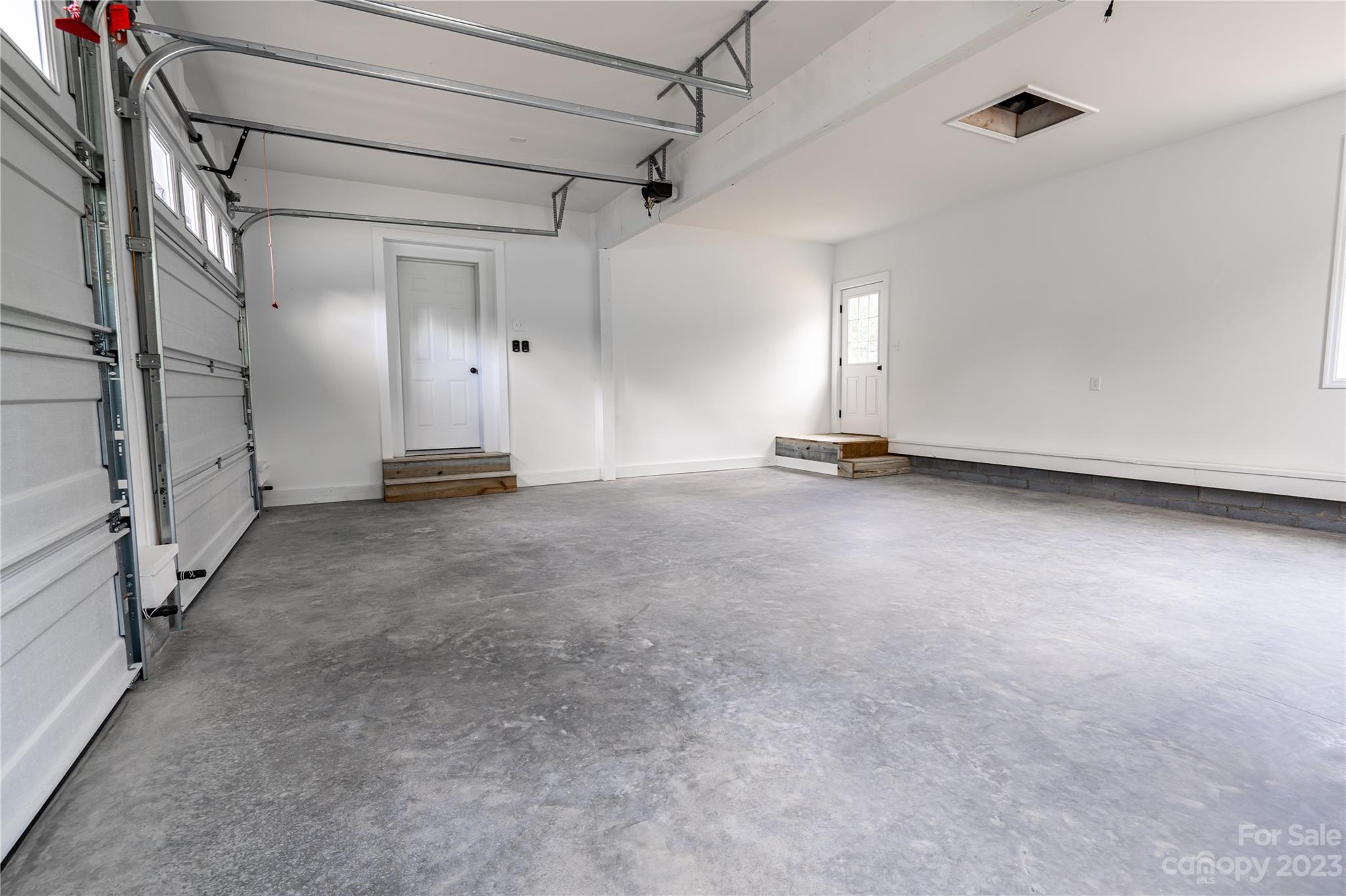 85 Rocky Lane Road Clyde, NC 28721 - Photo 33 of 37 a view of empty room with wooden floor