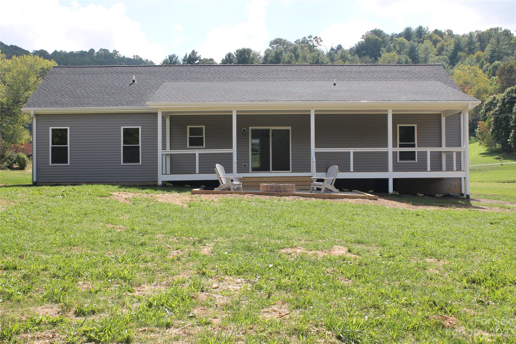 85 Rocky Lane Road Clyde, NC 28721 - Photo 6 of 37 a view of a house with garden