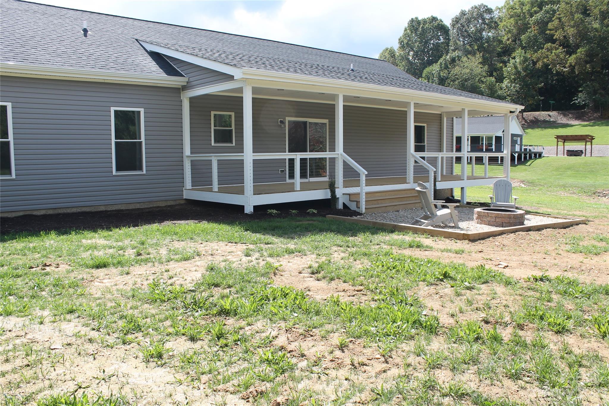 85 Rocky Lane Road Clyde, NC 28721 - Photo 8 of 37 a house view with a garden space
