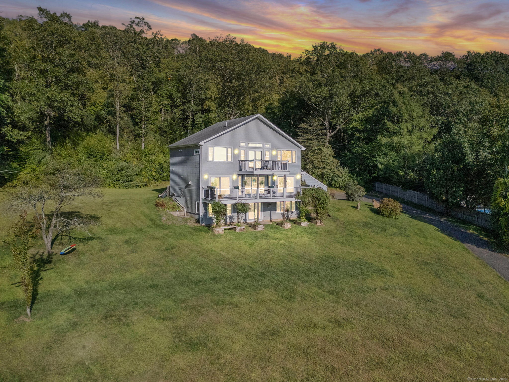 24 Coppergate Road East Granby, CT 06026 - Photo 12 of 39 a view of a big yard with a house in the background
