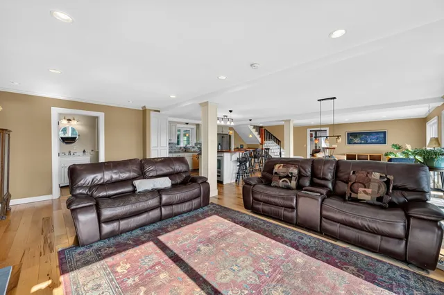 a living room with furniture and a rug