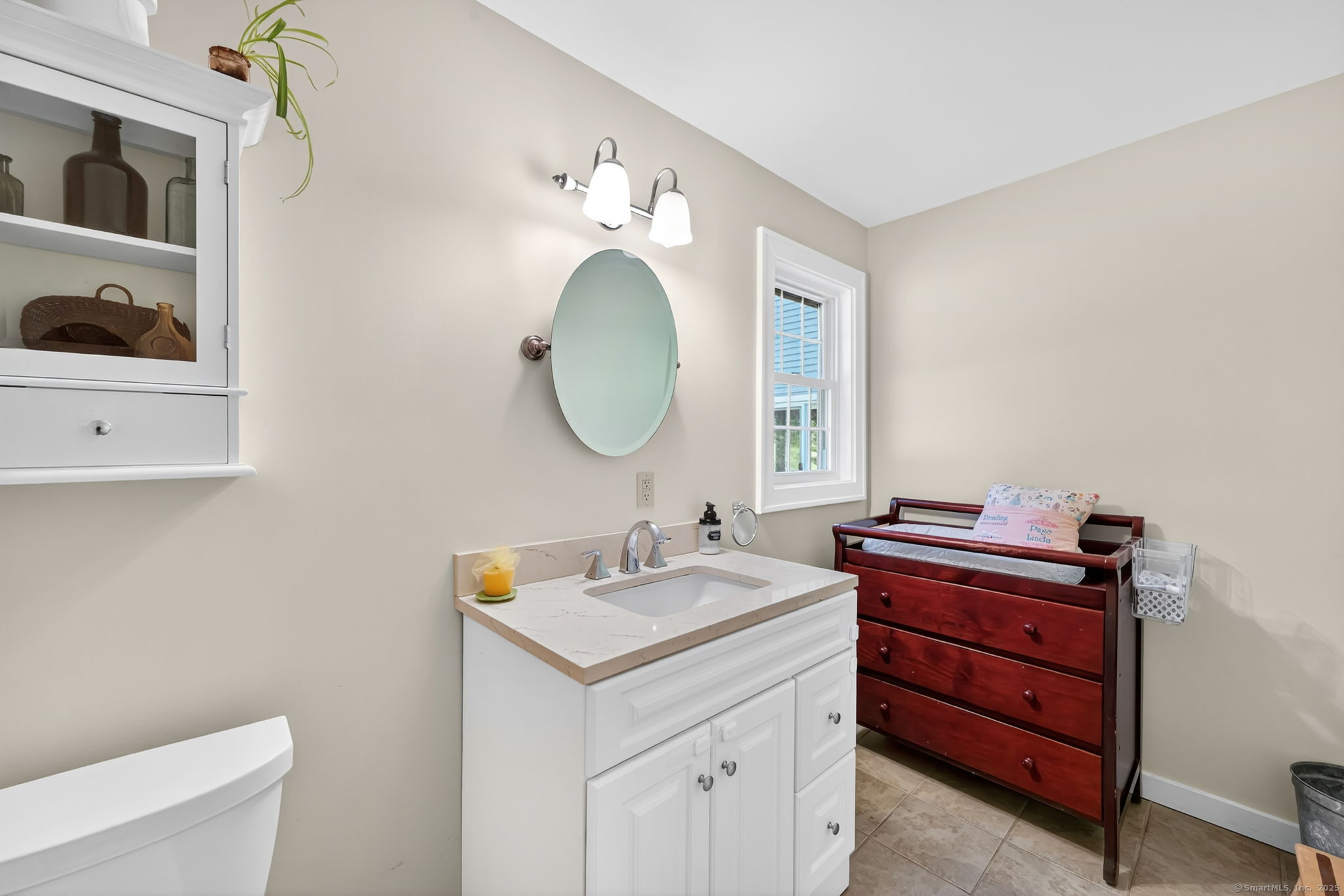 24 Coppergate Road East Granby, CT 06026 - Photo 24 of 39 a bathroom with a toilet a sink and a mirror