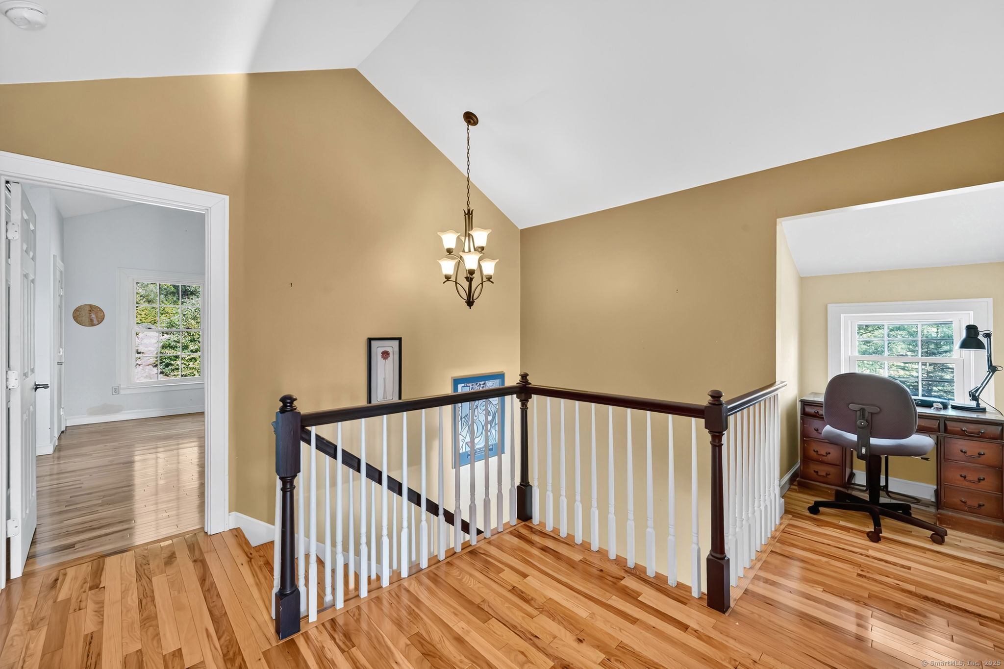 24 Coppergate Road East Granby, CT 06026 - Photo 26 of 39 a view of a hallway to a livingroom with furniture