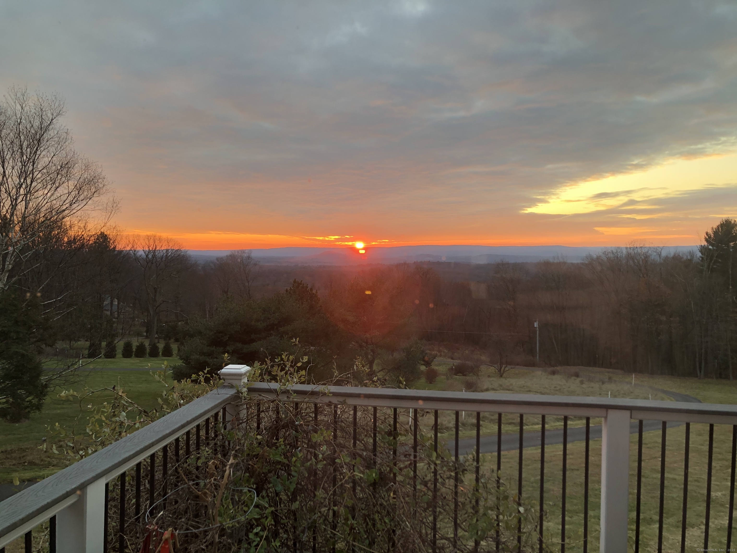 24 Coppergate Road East Granby, CT 06026 - Photo 3 of 39 a view of city and mountain from a balcony