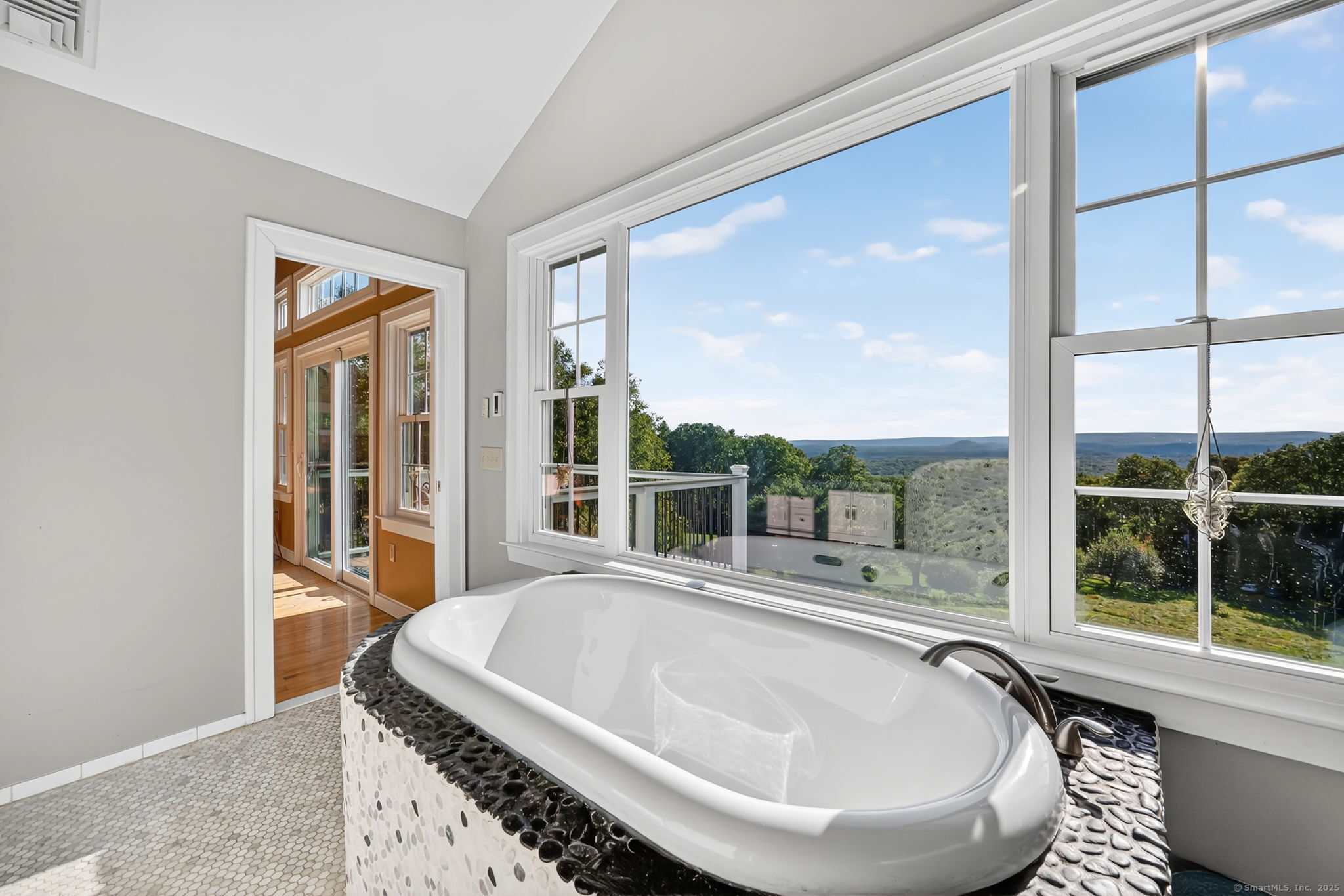 24 Coppergate Road East Granby, CT 06026 - Photo 31 of 39 a living room with a large window and a table