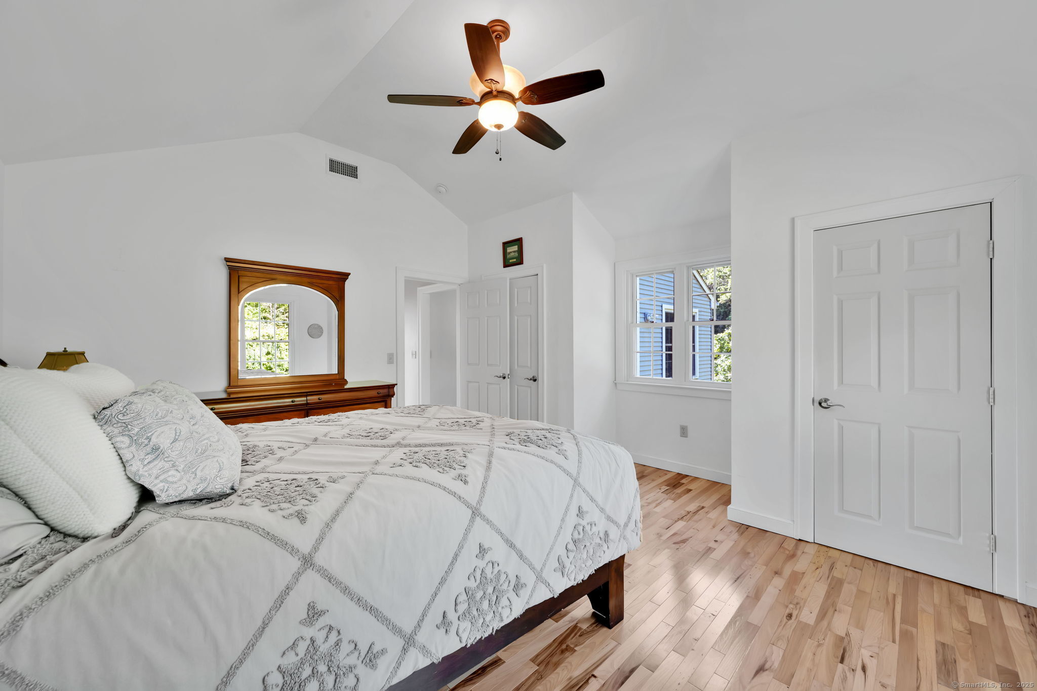 24 Coppergate Road East Granby, CT 06026 - Photo 34 of 39 a bedroom with a bed and a chandelier