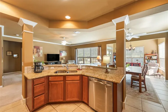 a kitchen with a sink stove and cabinets