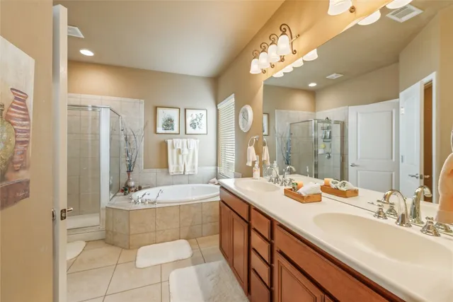 a spacious bathroom with a sink mirror and bathtub
