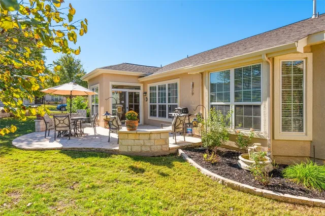 a view of a house with backyard porch and patio