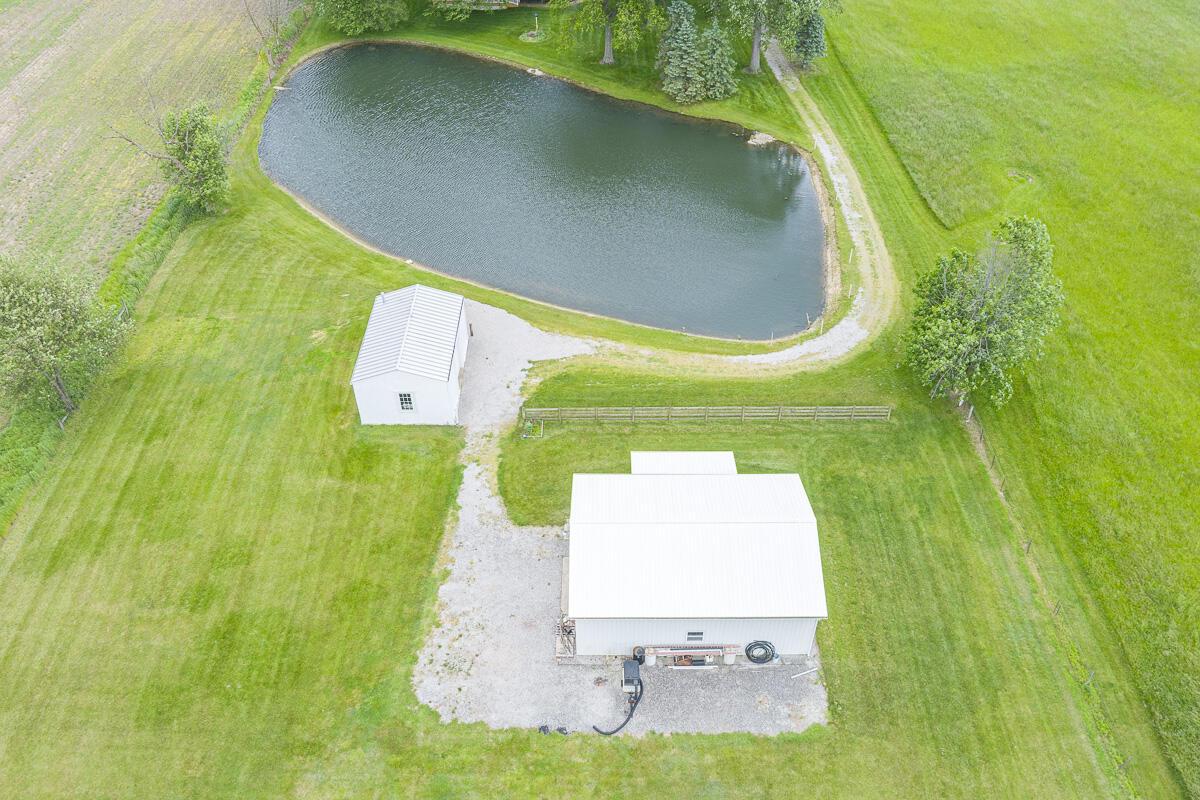 8430 Patterson Road Hilliard, OH 43026 - Photo 81 of 88 Drone photo of stocked pond, pole barn and tool shed.