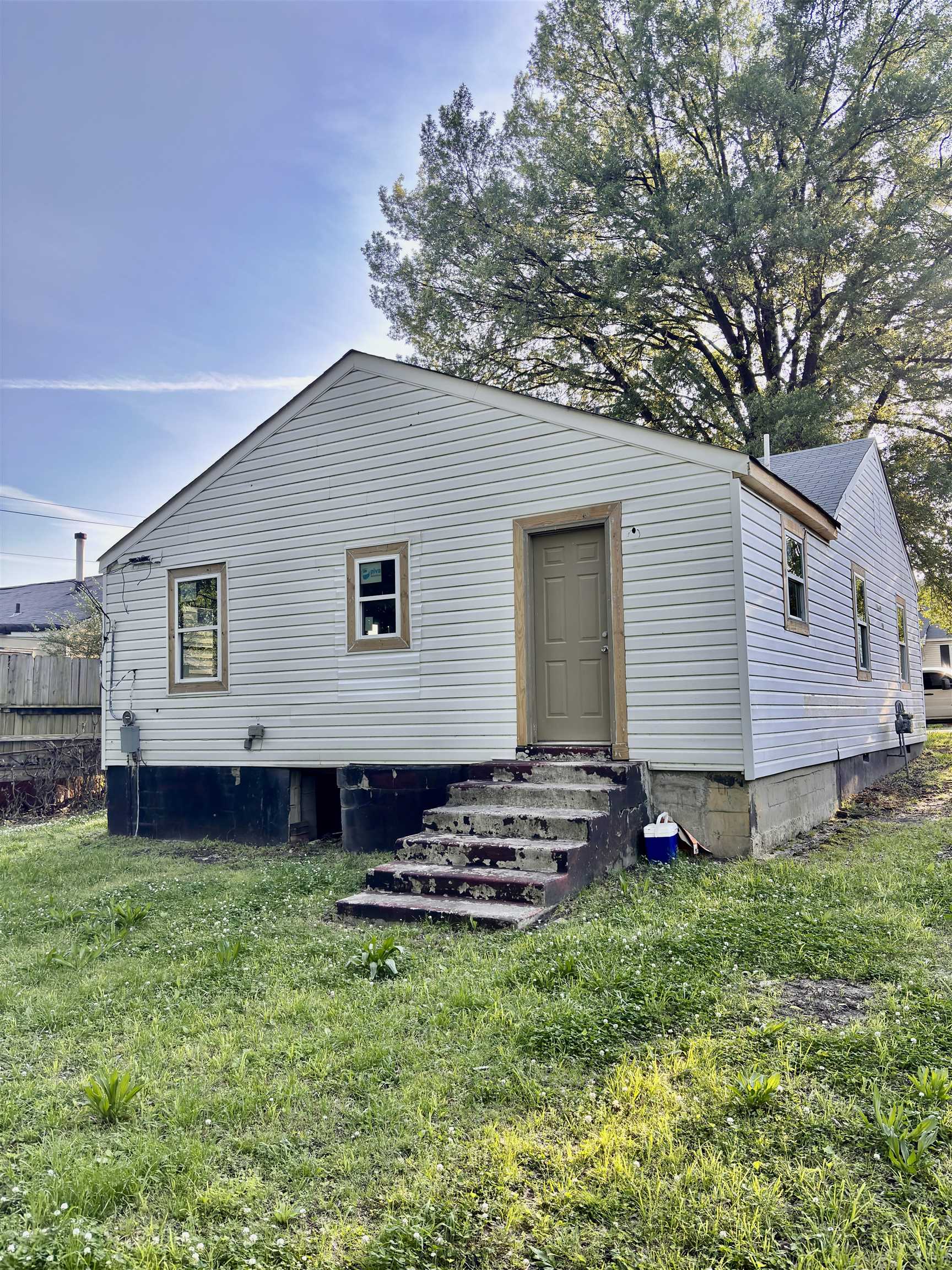 2136 Rile Street Memphis, TN 38109 - Photo 5 of 17 Back of property with a lawn, fence, crawl space, and entry steps