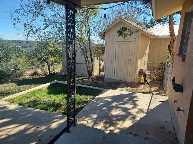 a view of a house with a small yard