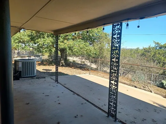 a stove top oven sitting inside of a kitchen