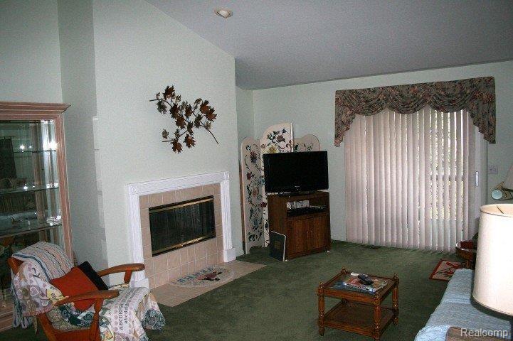 1124 Curzon Street, Unit 13 Howell, MI 48843 - Photo 10 of 12 Living Room w/ fireplace