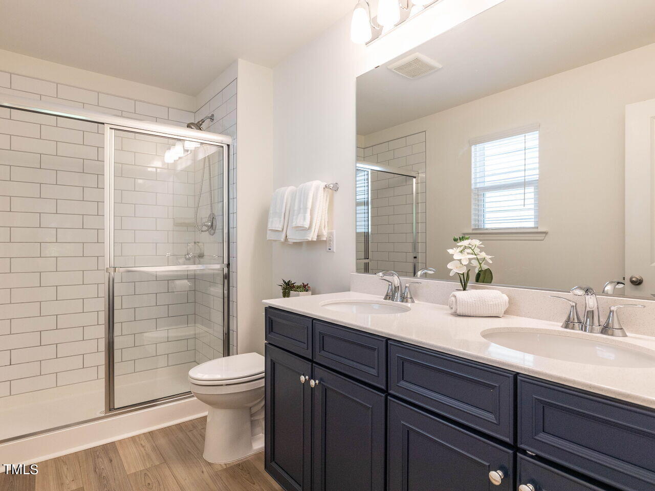 535 Hacksaw Trail Raleigh, NC 27610 - Photo 21 of 31 Tiled shower in Primary Bath, with dual vanity.