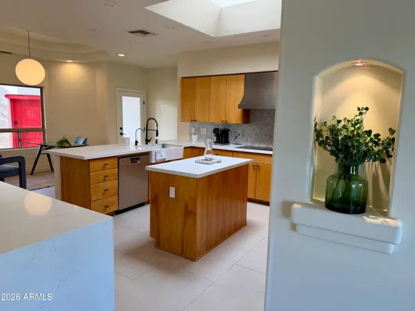 a kitchen with cabinets a sink and a stove