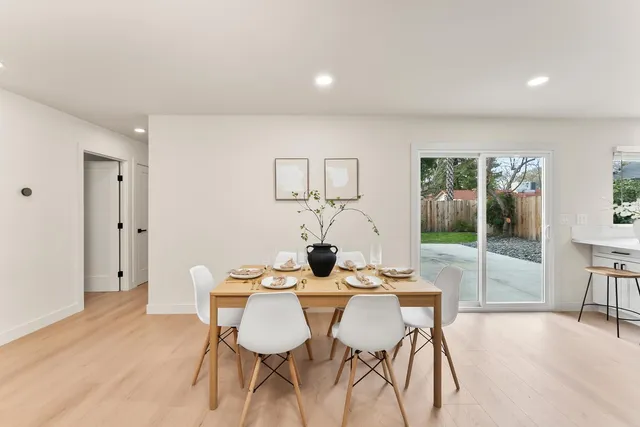 a dining room with furniture and window