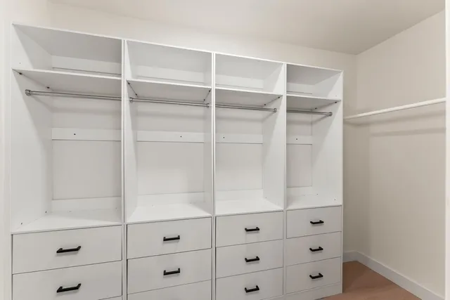 a view of an empty walk in closet