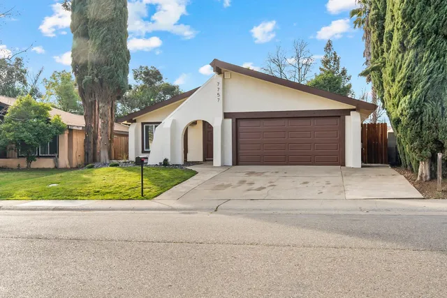 a view of garage yard and tree