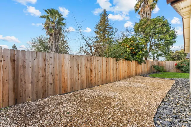 a house view with a backyard space