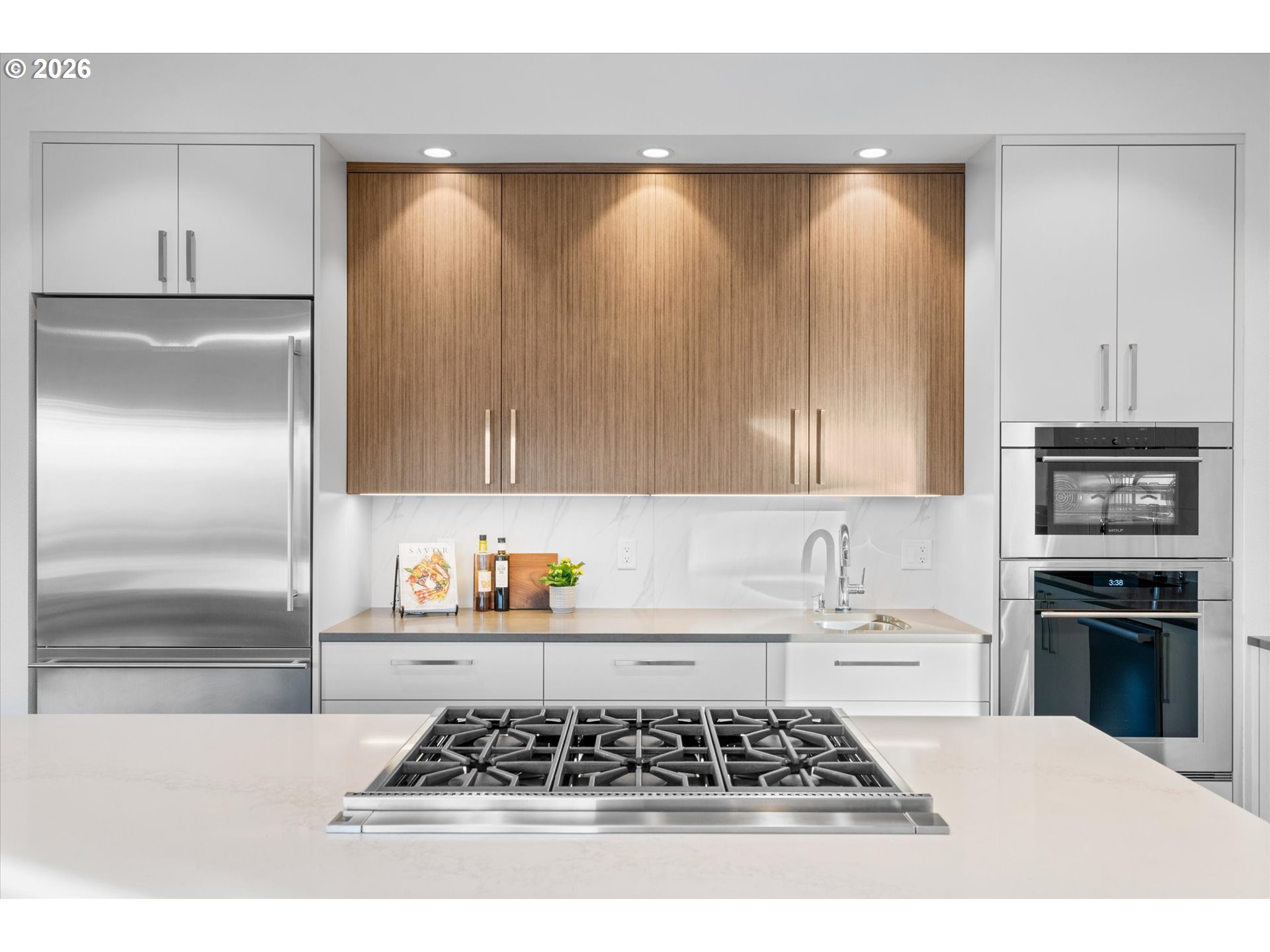 72 Nansen Summit Lake Oswego, OR 97035 - Photo 21 of 48 a kitchen with wooden cabinets and a stove top oven