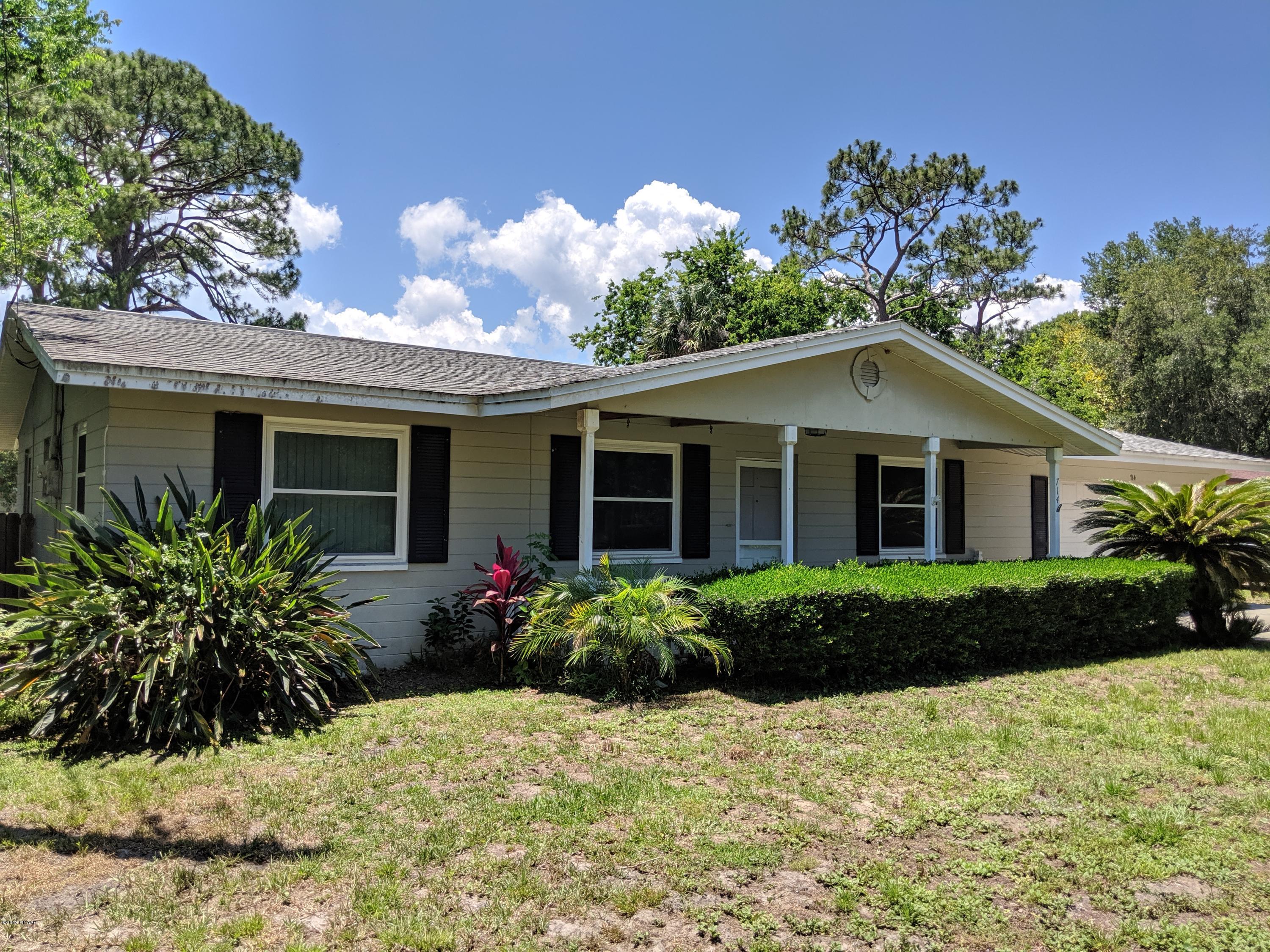 714 South Center Street Ormond Beach, FL 32174 - Photo 2 of 25 a front view of a house with a yard