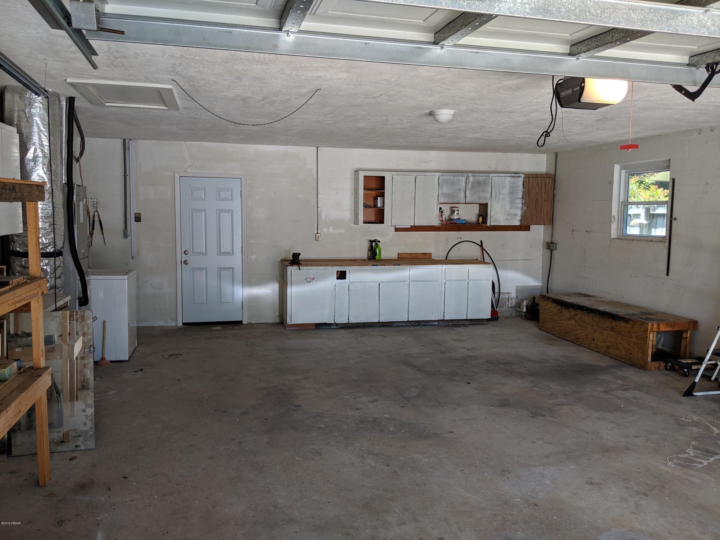 714 South Center Street Ormond Beach, FL 32174 - Photo 21 of 25 a living room with furniture and a window