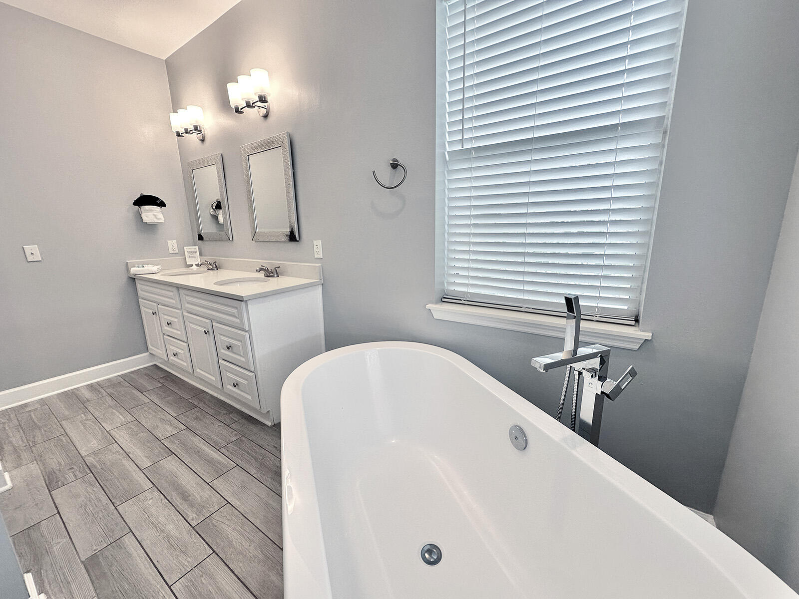 83 Sunfish Street Destin, FL 32541 - Photo 34 of 56 a bathroom with a sink and a mirror