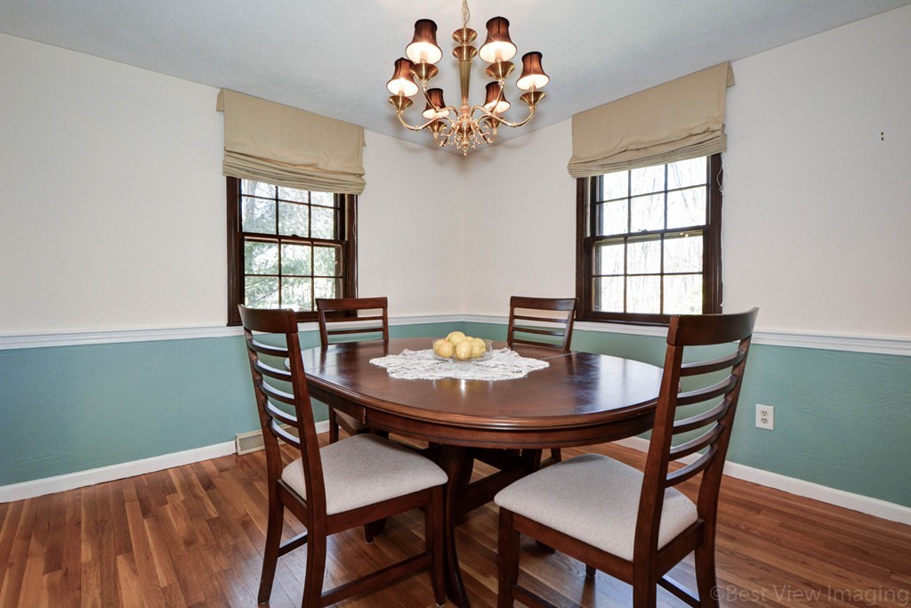 2 Linwood Road Framingham, MA 01702 - Photo 9 of 28 a view of a dining room with furniture a chandelier and wooden floor