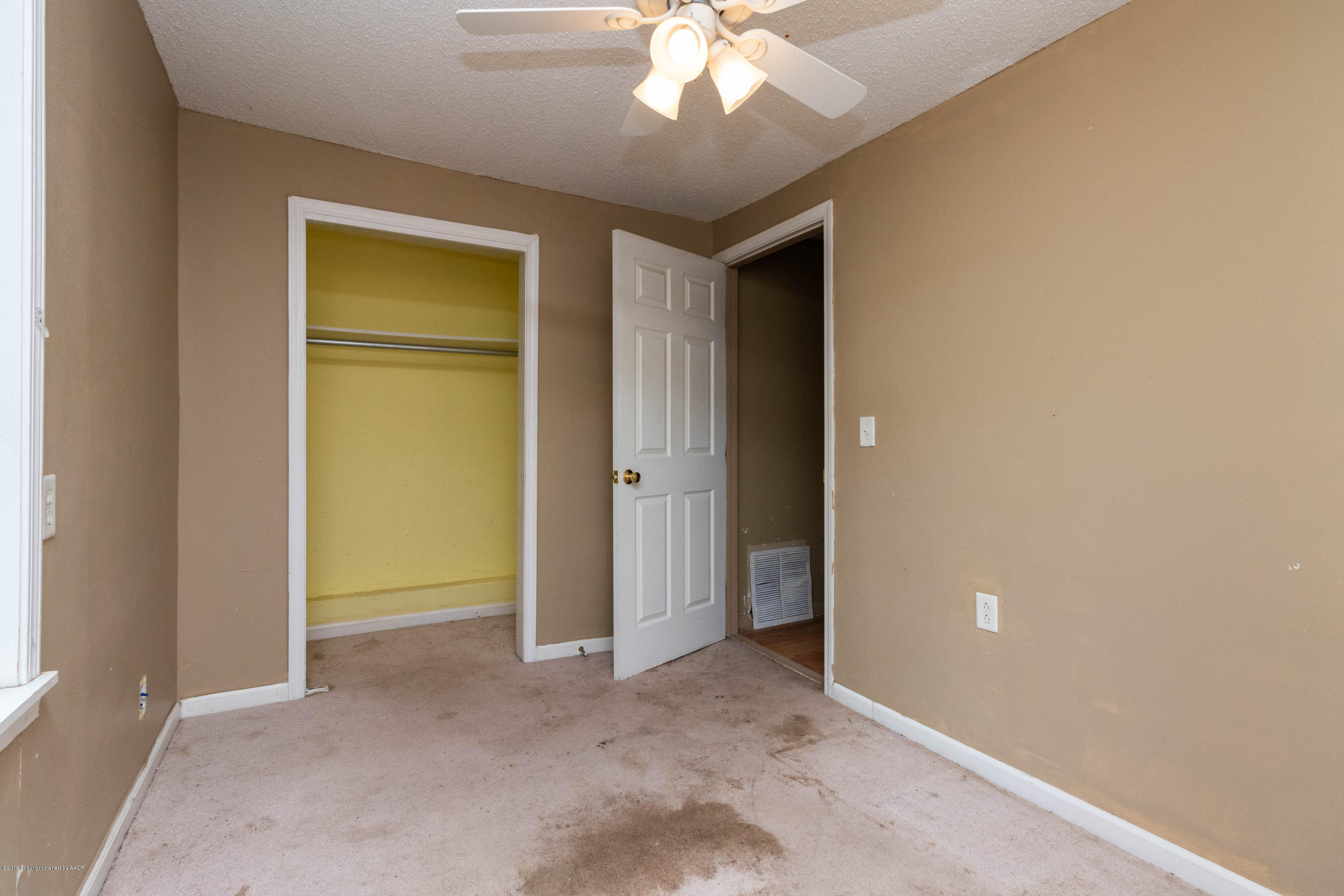 4002 South Harrison Street Amarillo, TX 79110 - Photo 13 of 21 an empty room with closet and a hallway