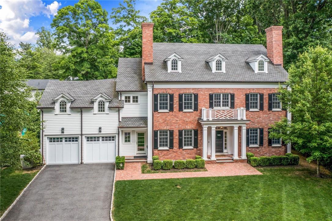 146 Fox Meadow Road Scarsdale, NY 10583 - Photo 1 of 35 front view of house with a yard