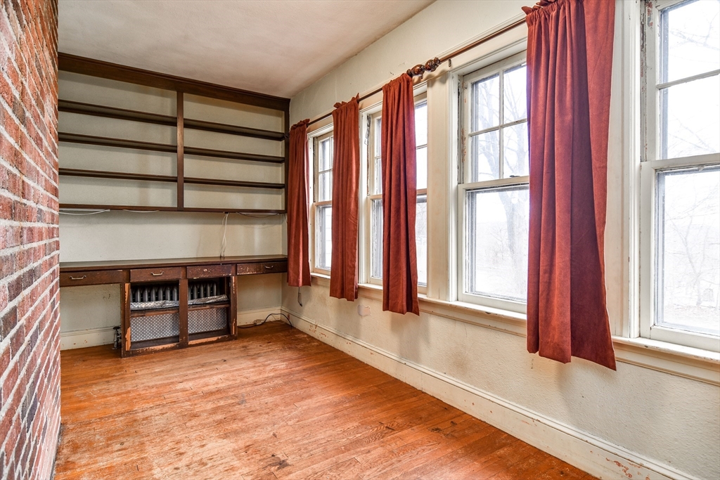 85 Barber Road Framingham, MA 01702 - Photo 14 of 30 a view of a room with a large window and a fireplace