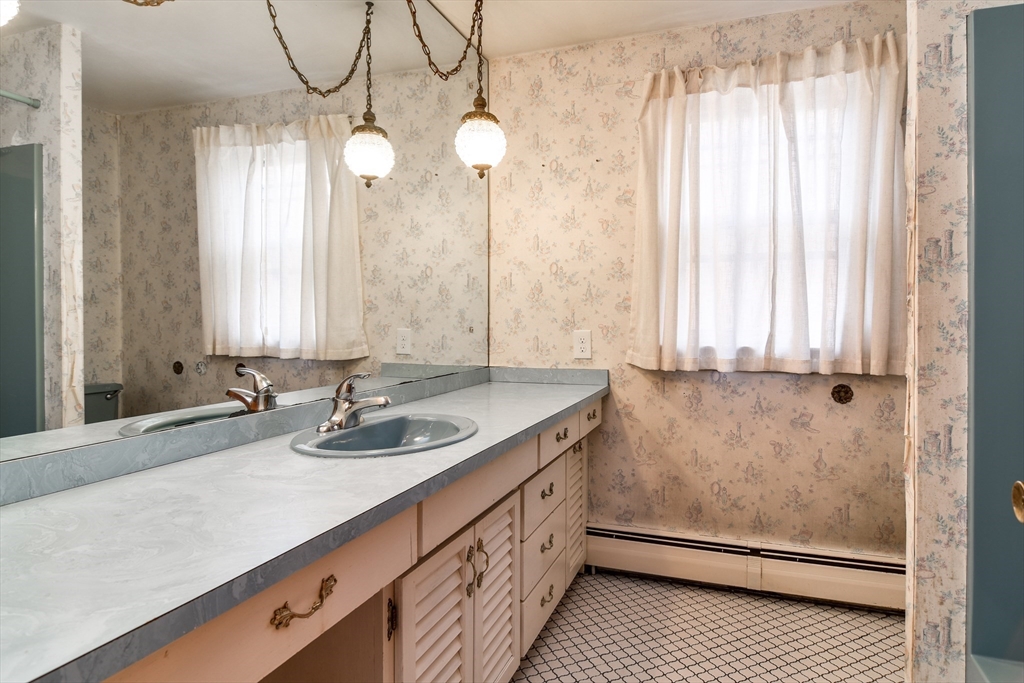 85 Barber Road Framingham, MA 01702 - Photo 17 of 30 a bathroom with a double vanity sink and a mirror