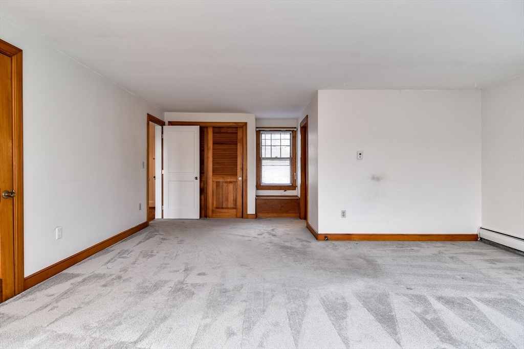 85 Barber Road Framingham, MA 01702 - Photo 18 of 30 a view of an empty room with closet and a window