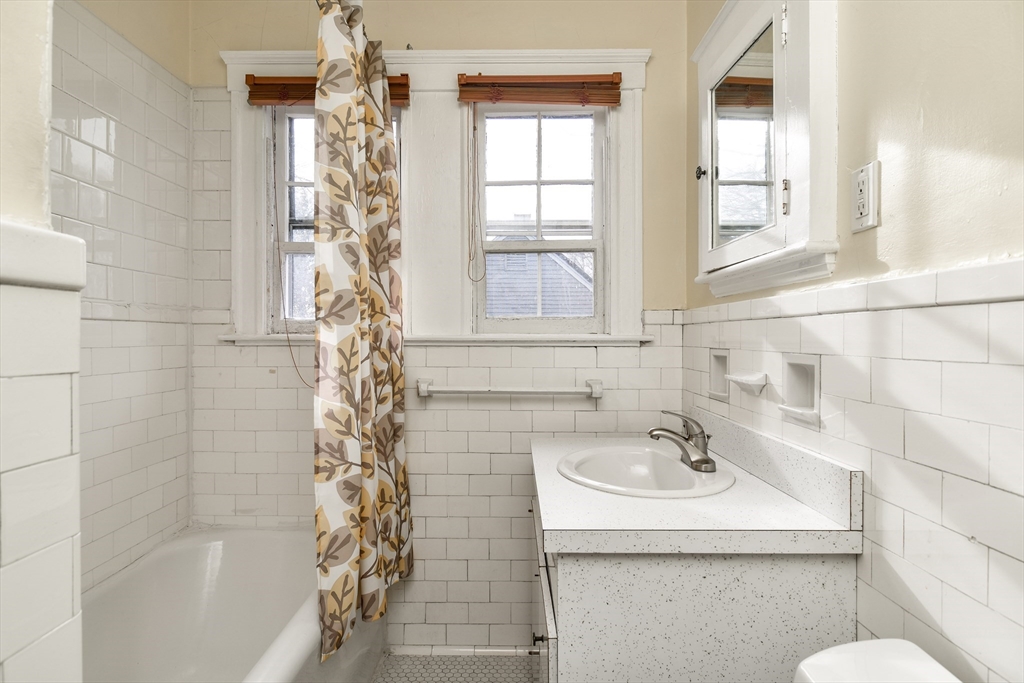 85 Barber Road Framingham, MA 01702 - Photo 21 of 30 a bathroom with a sink a toilet and shower