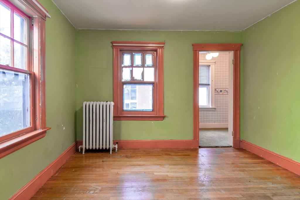 85 Barber Road Framingham, MA 01702 - Photo 22 of 30 an empty room with wooden floor and windows