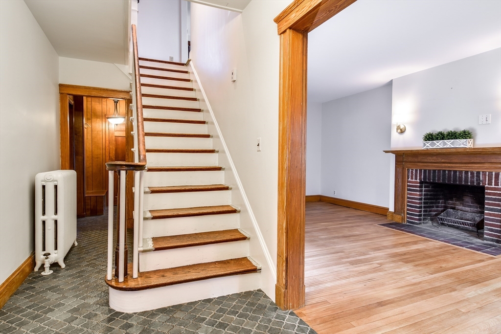 85 Barber Road Framingham, MA 01702 - Photo 3 of 30 a view of a livingroom with entryway and wooden floor