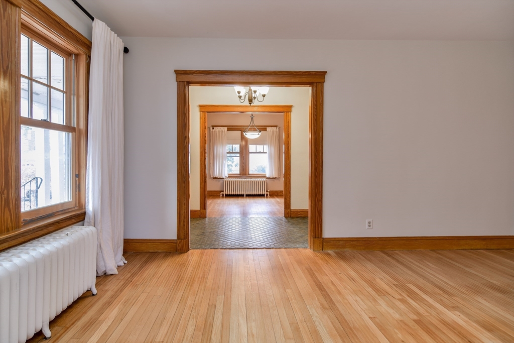 85 Barber Road Framingham, MA 01702 - Photo 5 of 30 a view of an empty room with wooden floor and a window