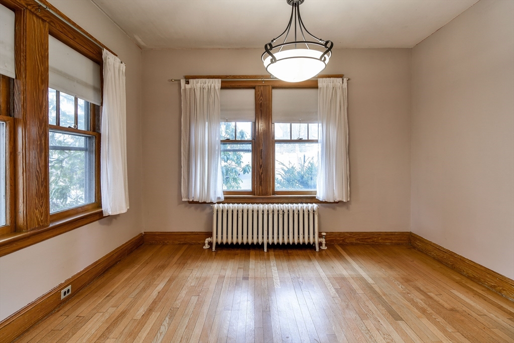 85 Barber Road Framingham, MA 01702 - Photo 6 of 30 an empty room with wooden floor and windows