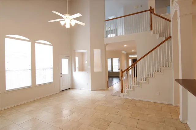 a view of entryway and hall with a chandelier