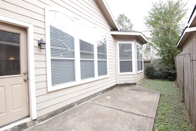 a view of house with backyard
