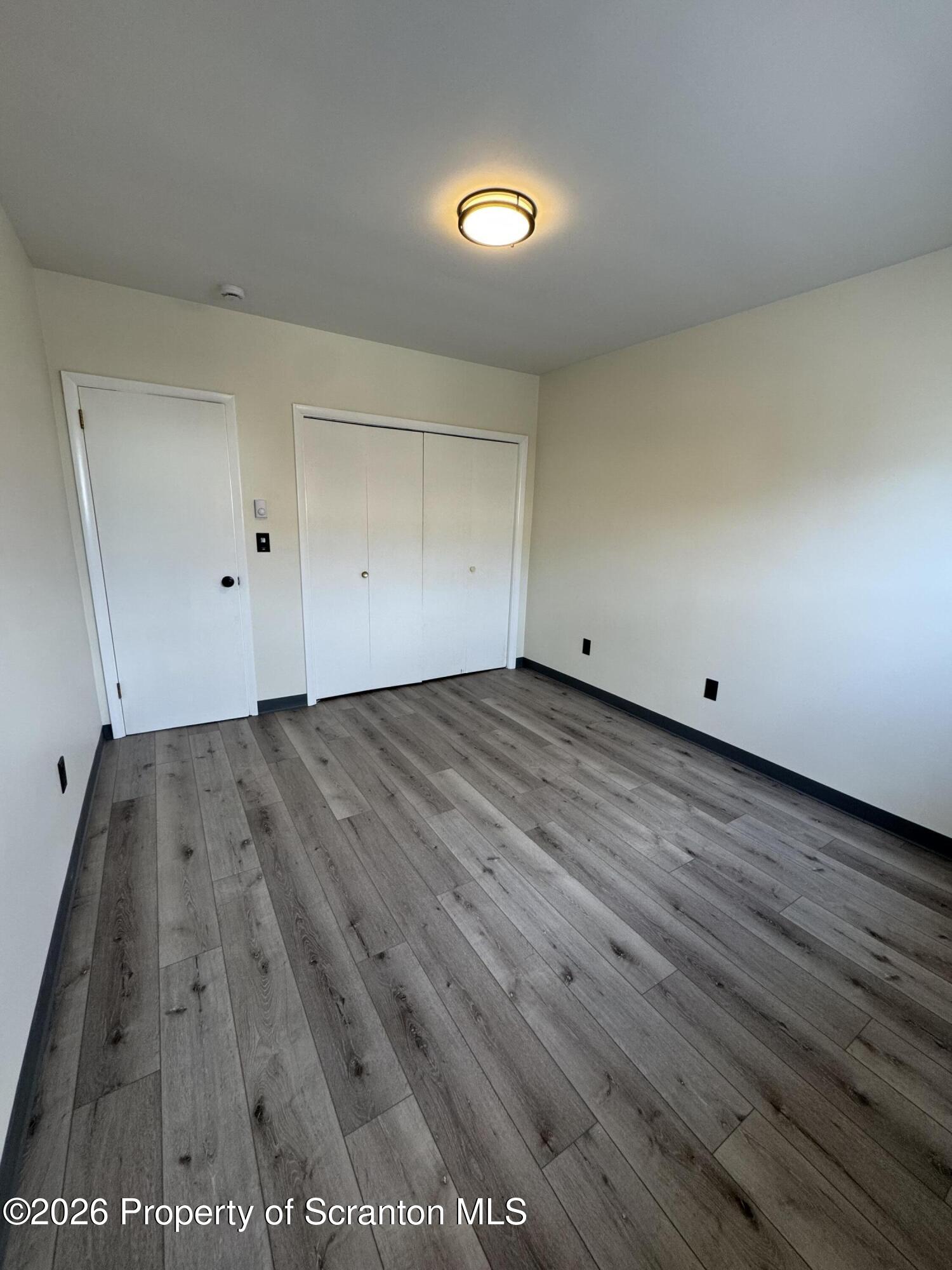 615 3rd Street, Unit 4 Dunmore, PA 18512 - Photo 14 of 17 a view of a room with wooden floor