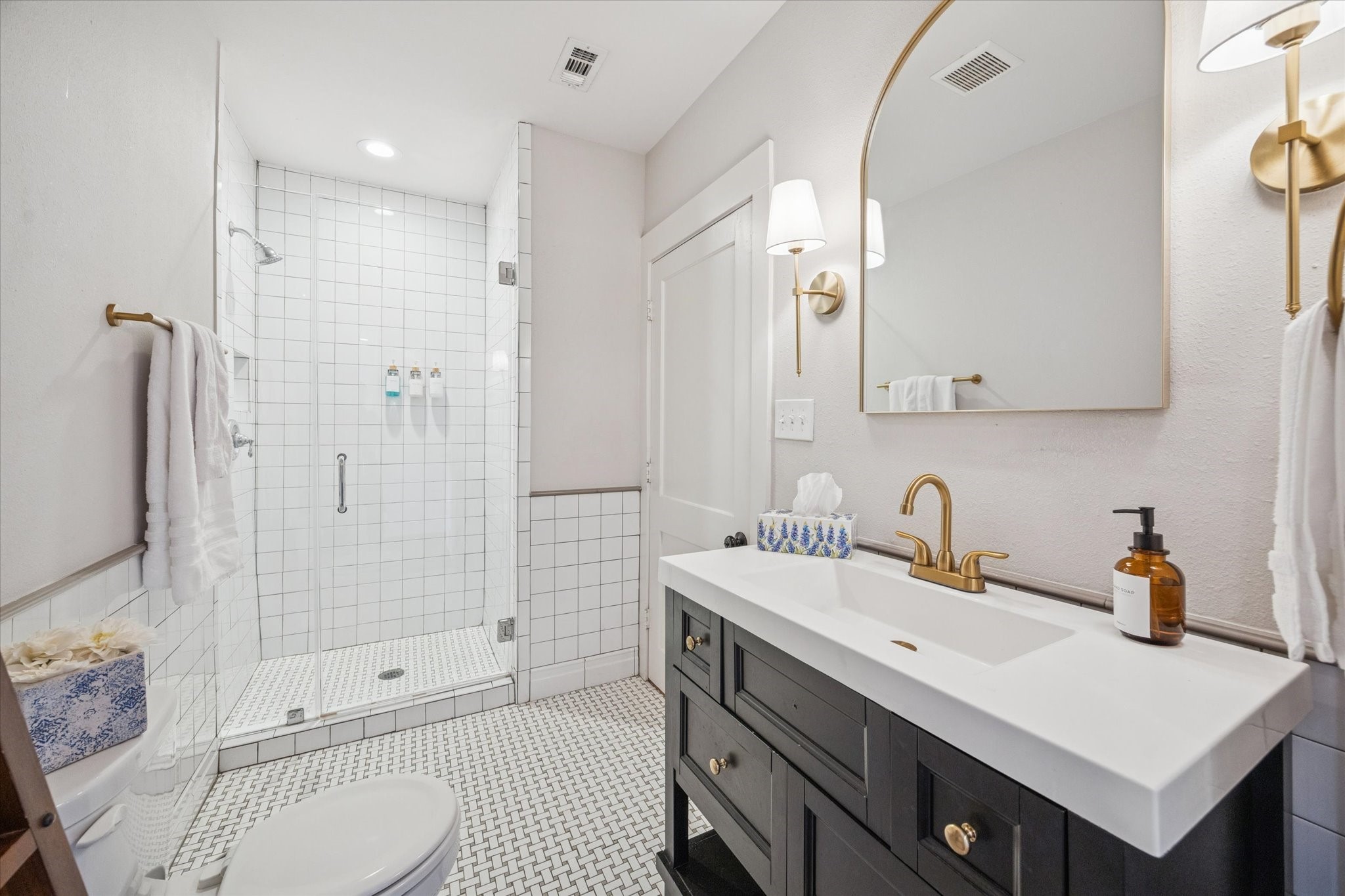 4605 Fisk Street Houston, TX 77009 - Photo 14 of 22 a bathroom with a sink double vanity and shower