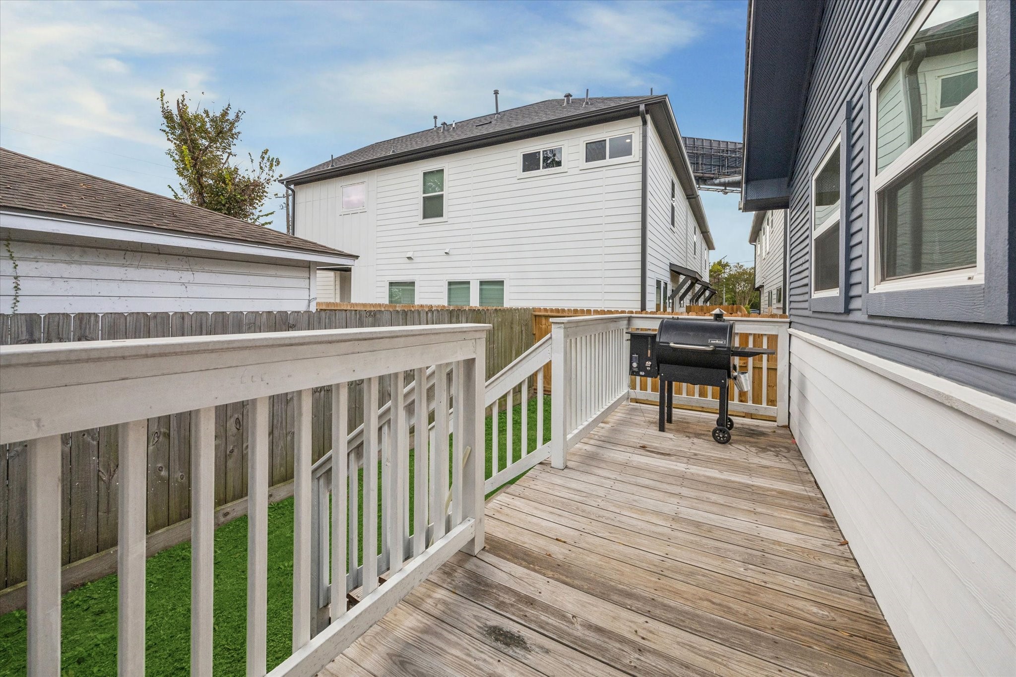 4605 Fisk Street Houston, TX 77009 - Photo 17 of 22 a view of a house with wooden deck