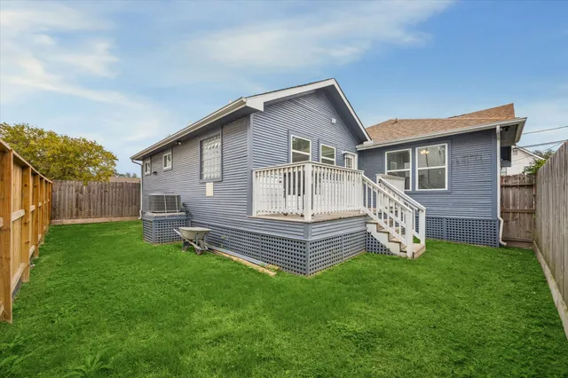 a view of a house with wooden deck