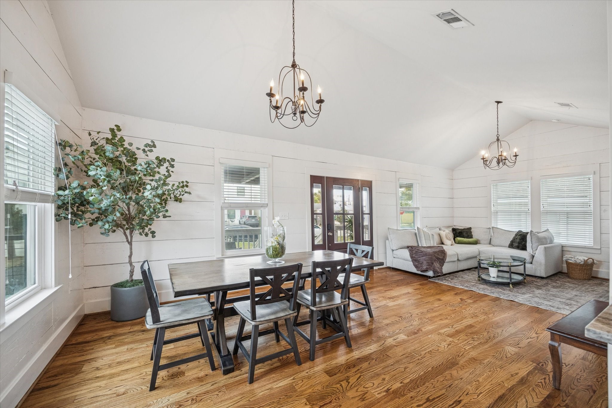 4605 Fisk Street Houston, TX 77009 - Photo 4 of 22 a view of a dining room with furniture window and wooden floor