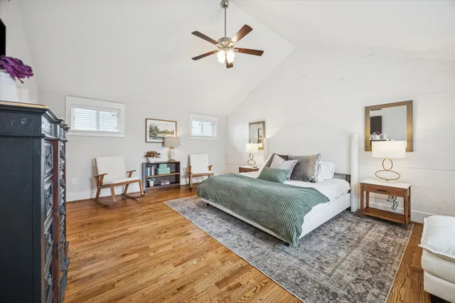 a large kitchen with stainless steel appliances granite countertop a stove a sink and a white cabinets