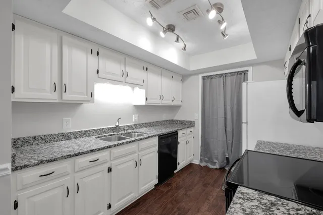 a kitchen with a stove and a microwave