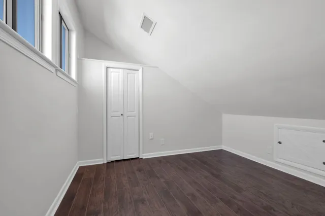 a view of an empty room with a balcony